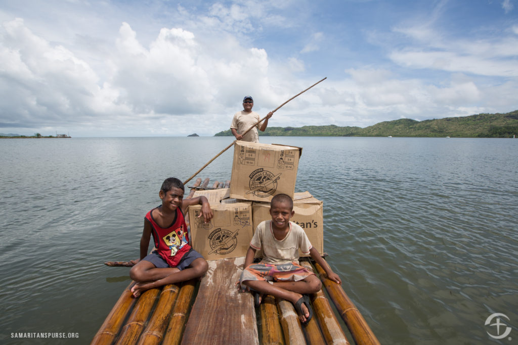 Shoeboxes traveling by raft in Fiji
