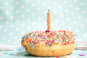 donut with sprinkles and candle