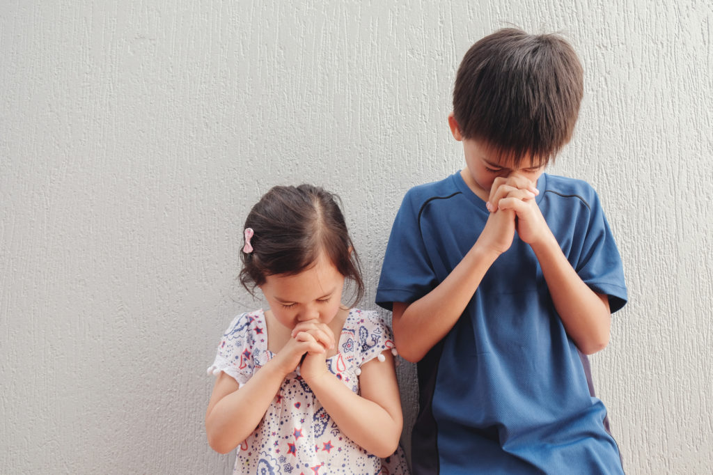 boy and girl praying 