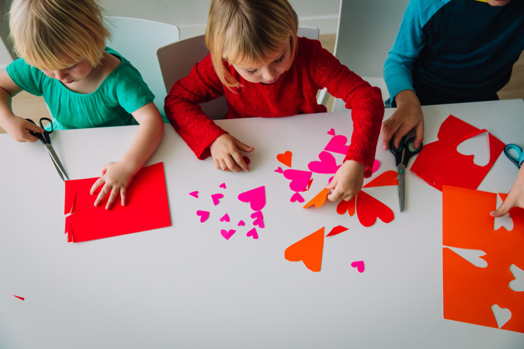 kids making hearts from paper, prepare for valentine day box